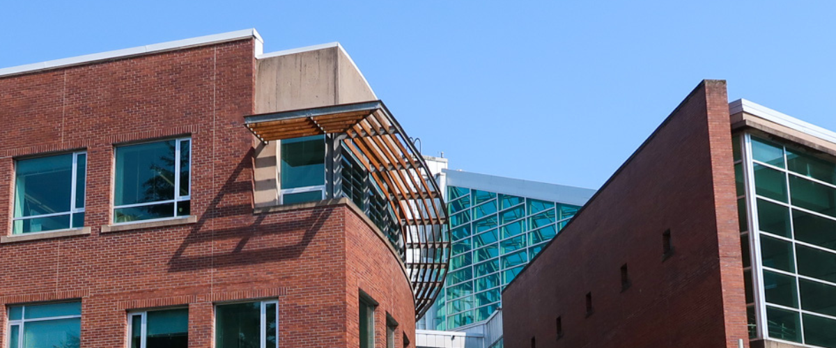 A JIBC campus building with many windows on it.