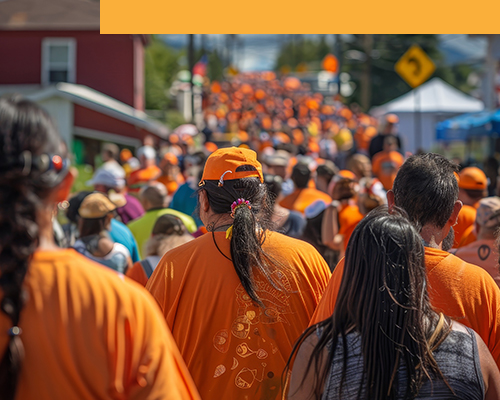 Community wearing orange shirts, coming together to observe the National Day for Truth and Reconciliation.