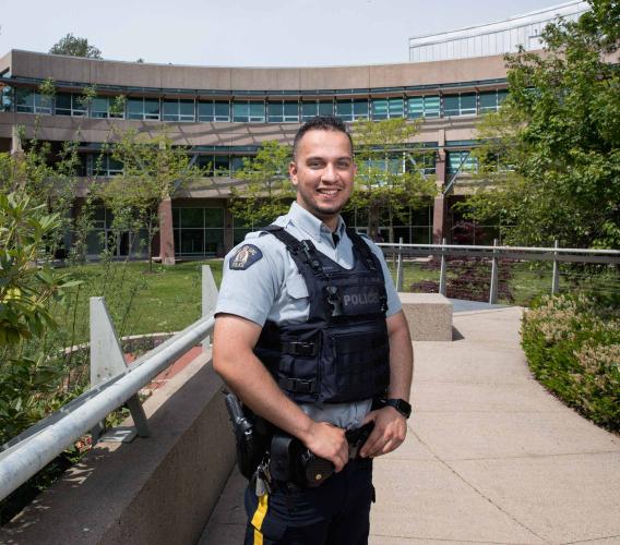 Two years after graduating from JIBC, Mansoor Sahak was hired as an RCMP officer, a role he hopes will help him to give back to Canada for taking in his family as refugees.