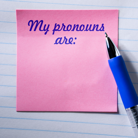 A pink post-it-note with text 'my pronouns are:' on it