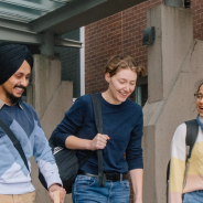 A group of students standing in front of a JIBC campus building.